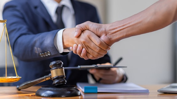 Estate planning lawyer shaking clients hand