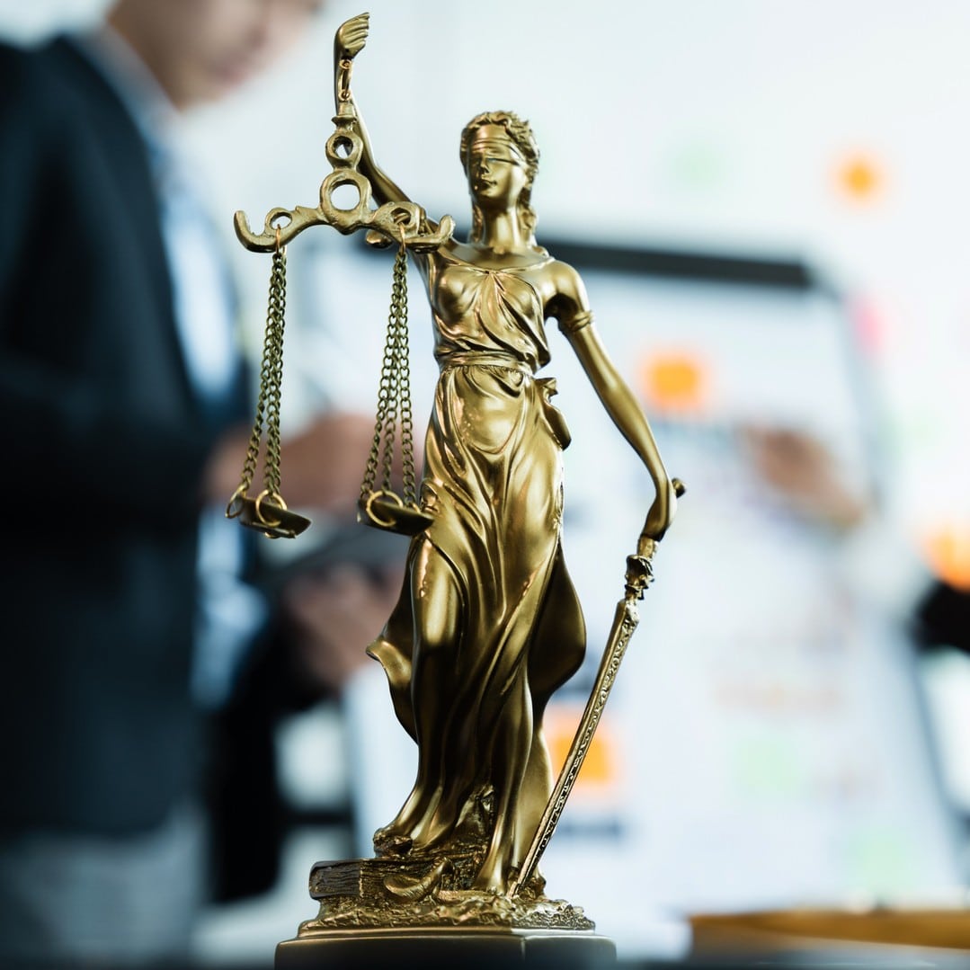 Lady justice scales up close on table